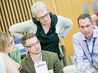 people talking at conference table