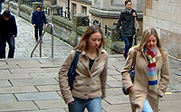 Two students walking by the University