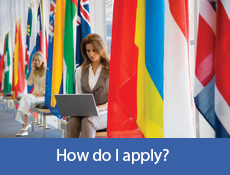 Person sat between lots of flags