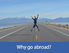 Person in the middle of a road jumping in the air