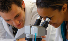 Students looking through microscope