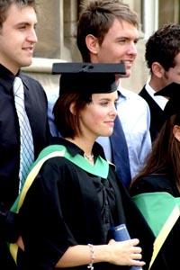 Girl holding her graduation certificate.