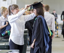NTU Student being gowned for Graduation