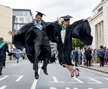 Two jumping students graduation at NTU