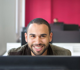 Boots Library, Level 2, male student using fixed PC