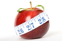 An apple with a tapemeasure