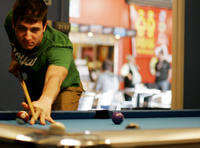 Student playing snooker